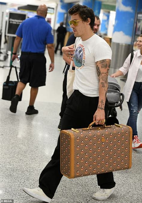 harry styles gucci suitcase|harry styles white suit.